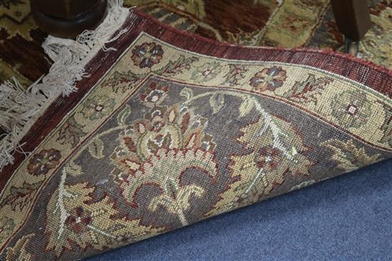 A Persian style tan ground carpet 306cm x 250cm